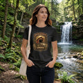 Woman wearing a black t-shirt with graphic design - bean blossom bridge Shirt, in a nature park.