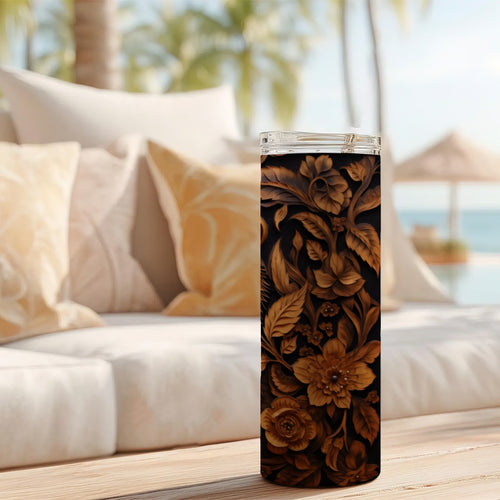 20 oz straight tumbler with 3D tooled leather bear design on a table outdoors.