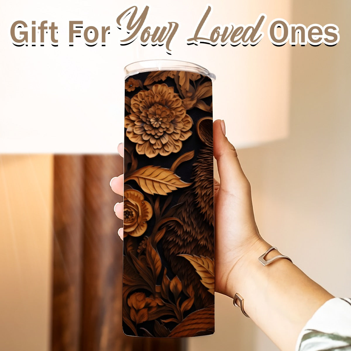 Hand holding a 20 oz straight tumbler- tooled leather bear design
Gift For Your Loved Ones on a blurred background.