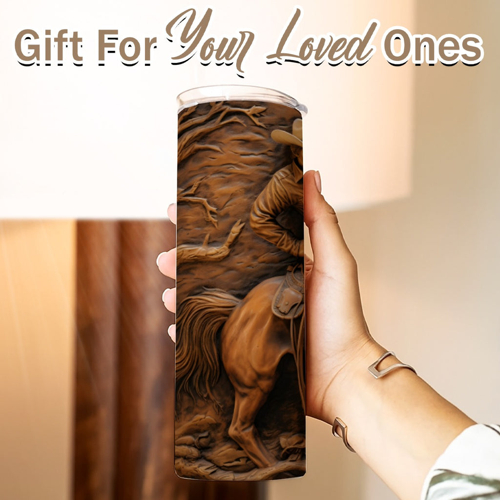 Hand holding a 20 oz straight tumbler- tooled leather cowboy design
Gift For Your Loved Ones on a blurred background.