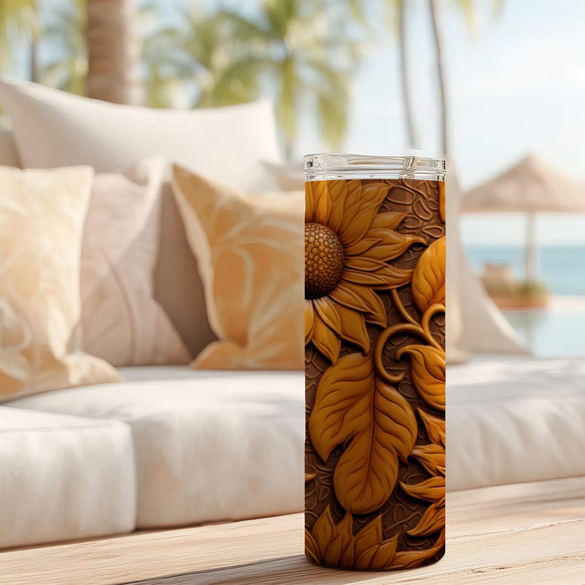 20 oz straight tumbler with 3D tooled leather dark-sunflower design on a table outdoors.