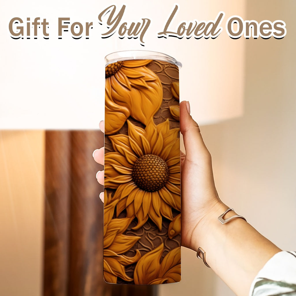 Hand holding a 20 oz straight tumbler- tooled leather dark-sunflower design
Gift For Your Loved Ones on a blurred background.