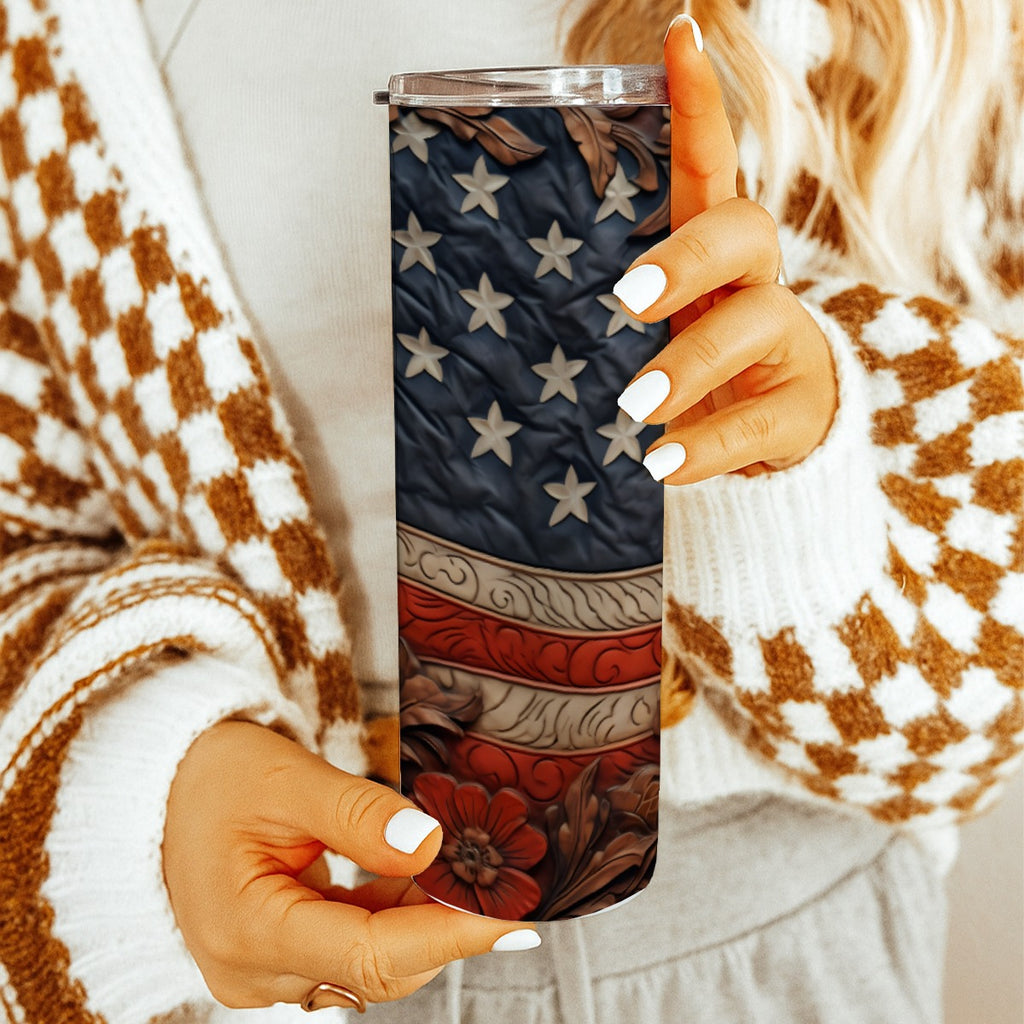 Woman holding 20 oz straight tumbler with 3D tooled leather flag design.