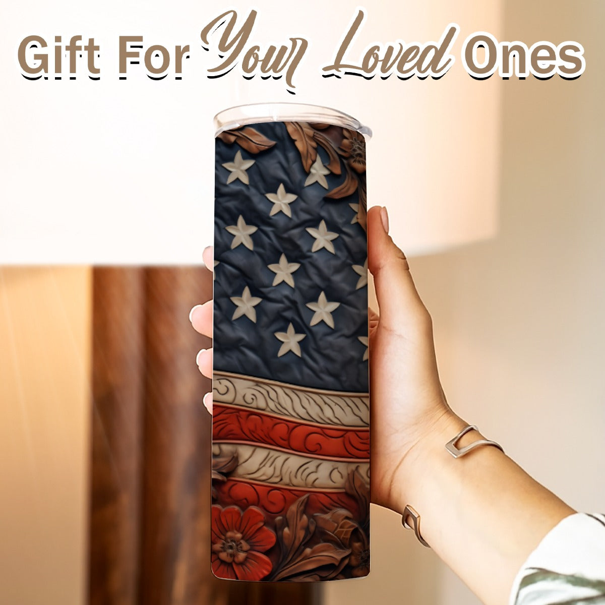 Hand holding a 20 oz straight tumbler- tooled leather flag design
Gift For Your Loved Ones on a blurred background.