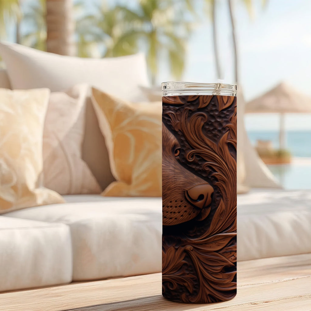 20 oz straight tumbler with 3D tooled leather hunting dog design on a table outdoors.
