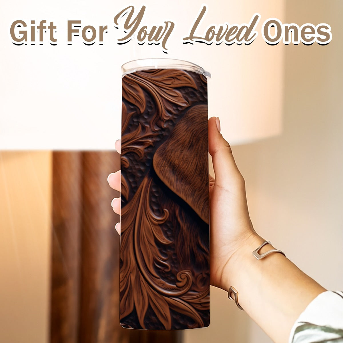 Hand holding a 20 oz straight tumbler- tooled leather hunting dog design
Gift For Your Loved Ones on a blurred background.