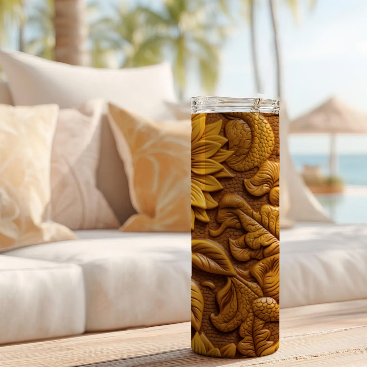 20 oz straight tumbler with 3D tooled leather sunflower design on a table outdoors.