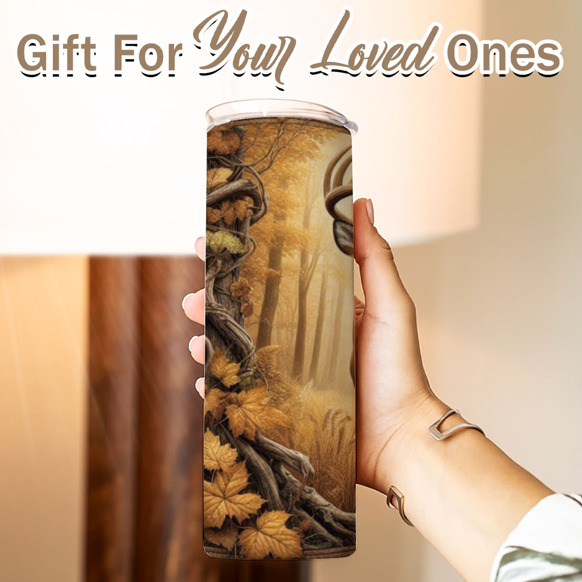 Hand holding a 20 oz straight tumbler with 3D tooled leather Whitetail deer design labeled - Gift for Your Loved Ones.