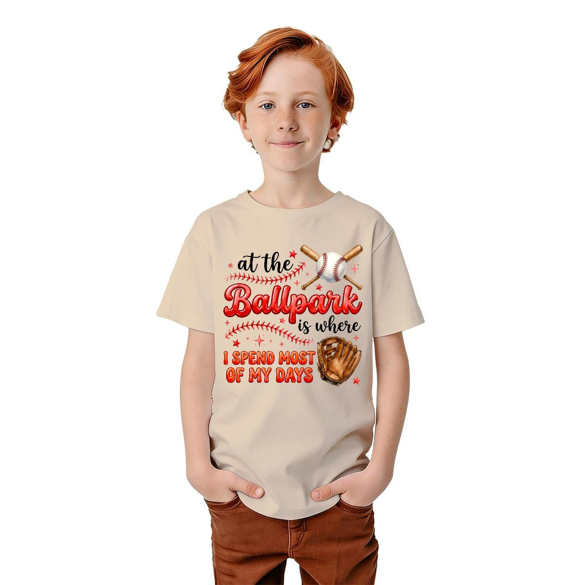 Child wearing a tan t-shirt with a baseball-themed design on a white background.