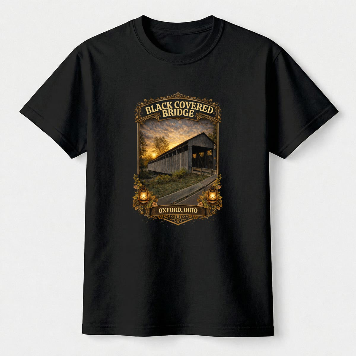 Black t-shirt with graphic design of Black Covered Bridge on a white background.