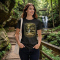 Woman wearing a black t-shirt with graphic design - Chasing Waterfalls Upper Old Man's Cave Shirt, in a nature park.