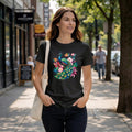 Woman wearing a black t-shirt with a peacock graphic design.
