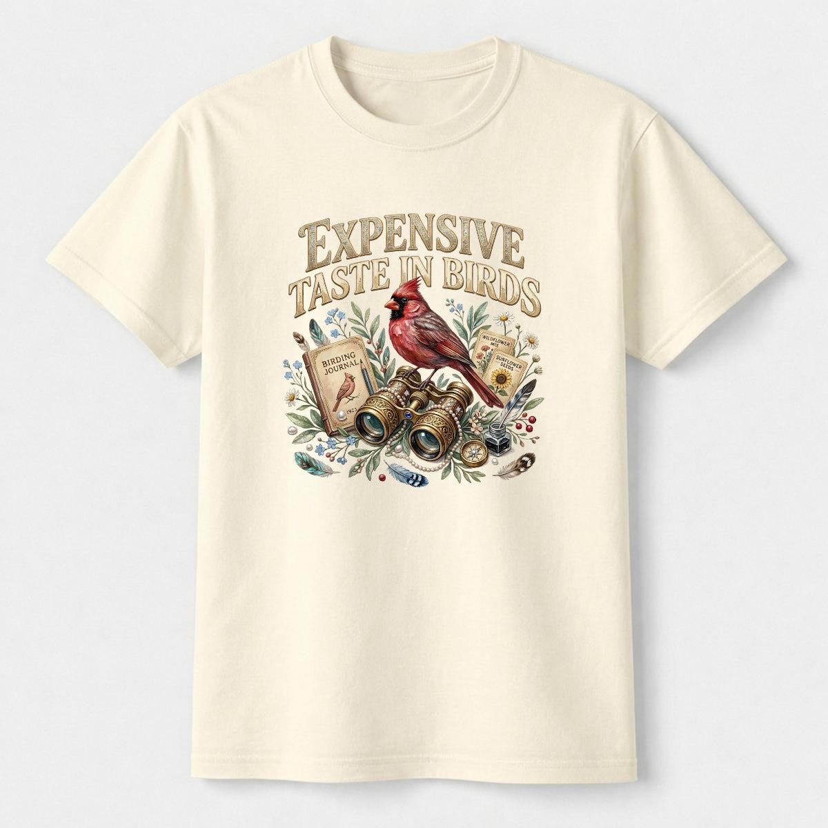 Natural-colored t-shirt with bird-themed graphic and text on a light grey background.