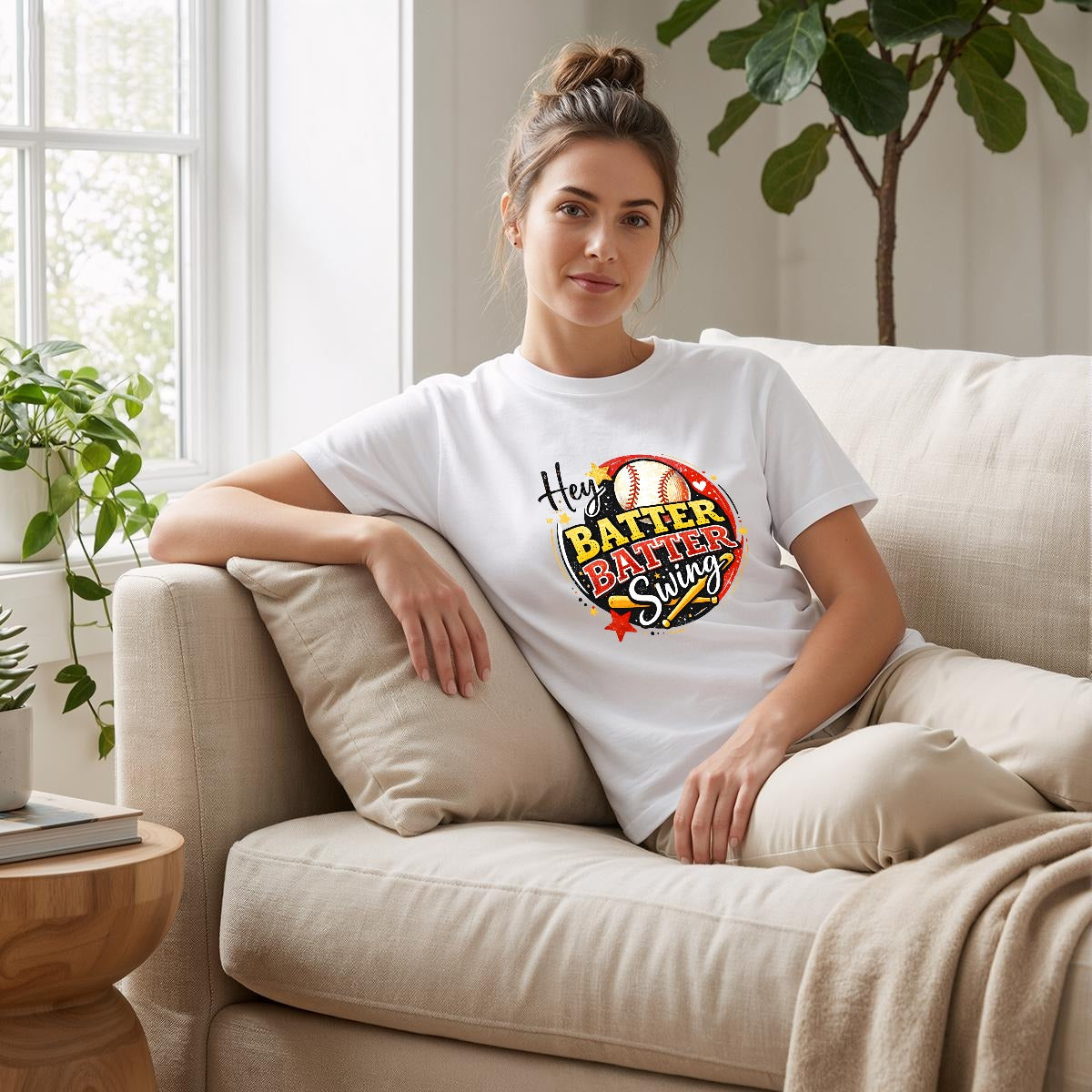 White t-shirt with a baseball-themed graphic and text on a white background.