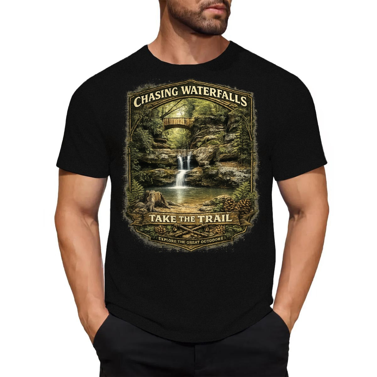 Man wearing Black t-shirt with graphic design - Chasing Waterfalls Upper Old Man's Cave Shirt on a white background.