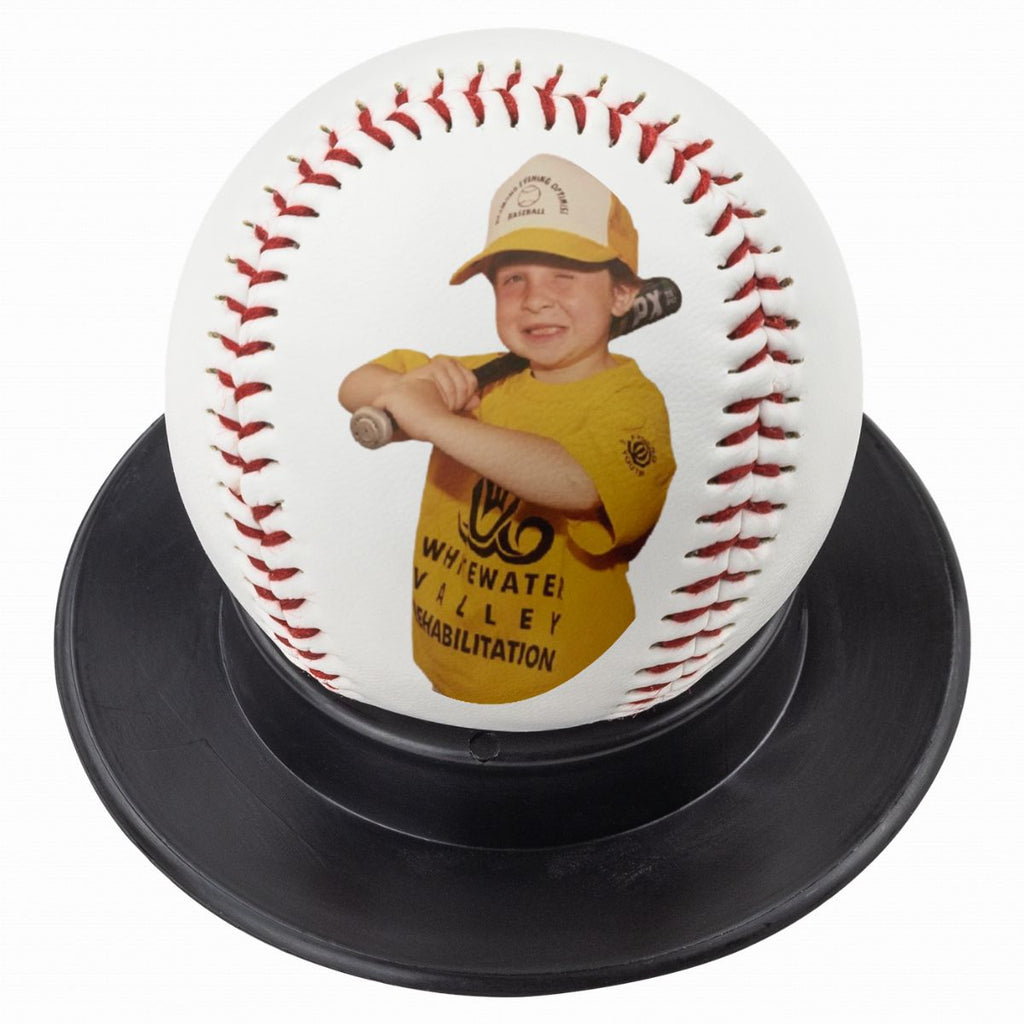 Custom photo baseball on black display stand, white background.