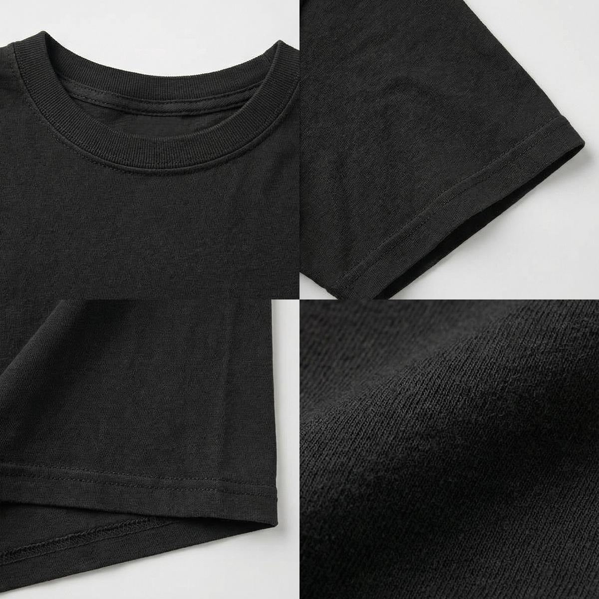 Close-up of a black t-shirt with details on fabric texture and stitching.